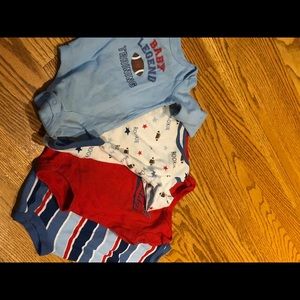 Four gently used Boy onsies